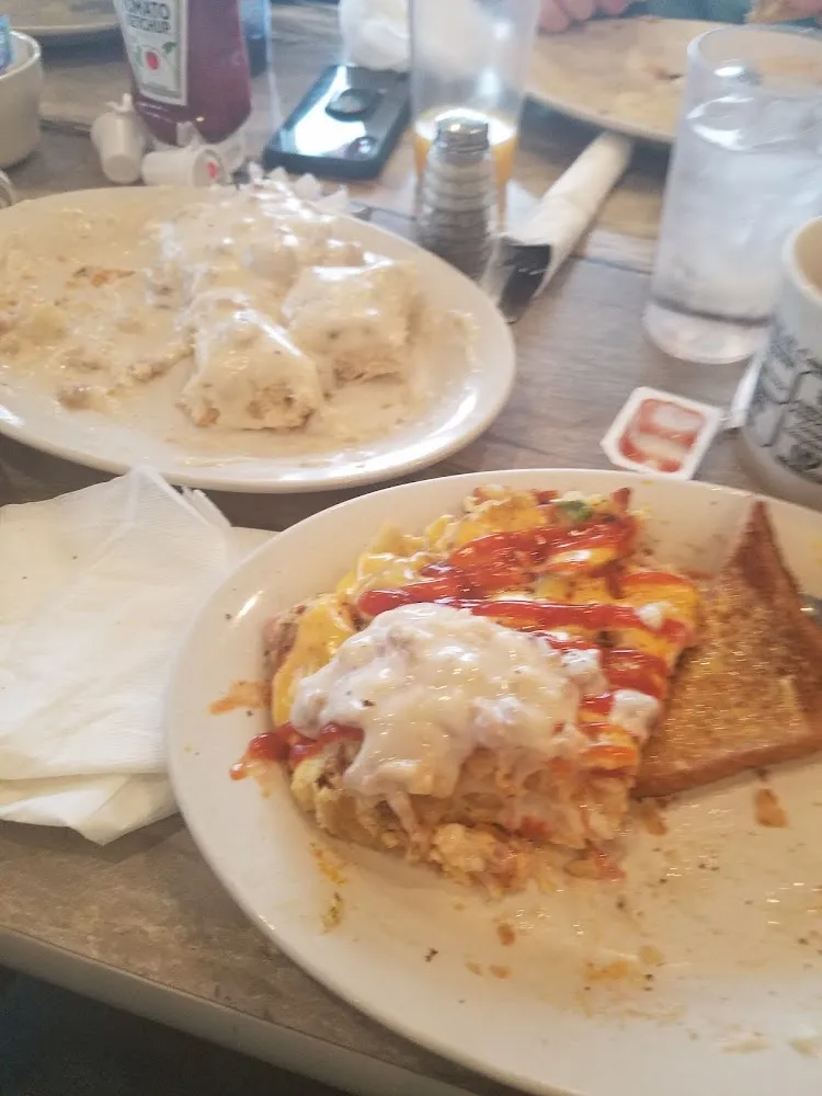 Biscuits and Gravy German Fried Potatoes with Eggs Ham Peppers and Cheese